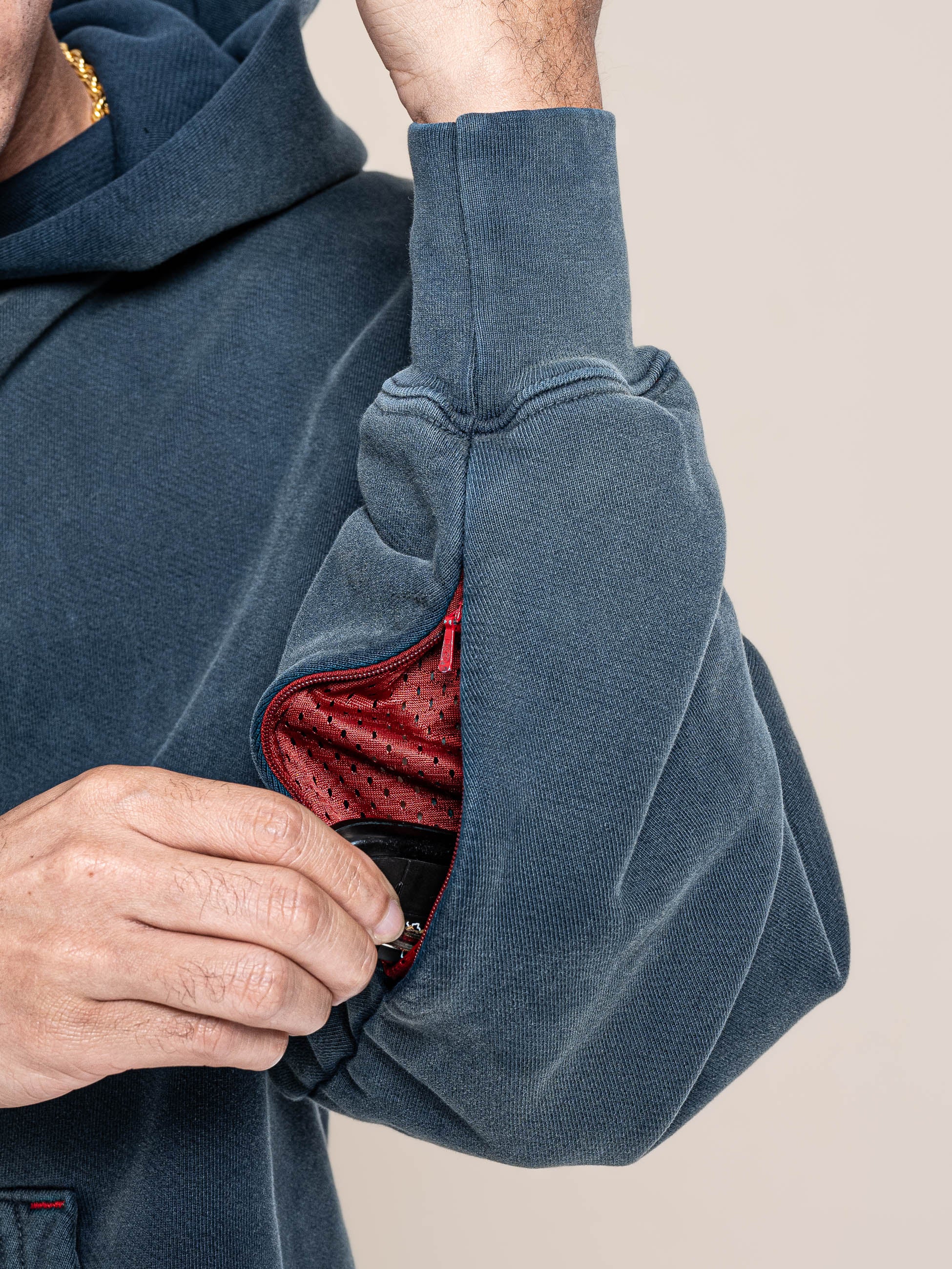 open hidden pocket at left arm