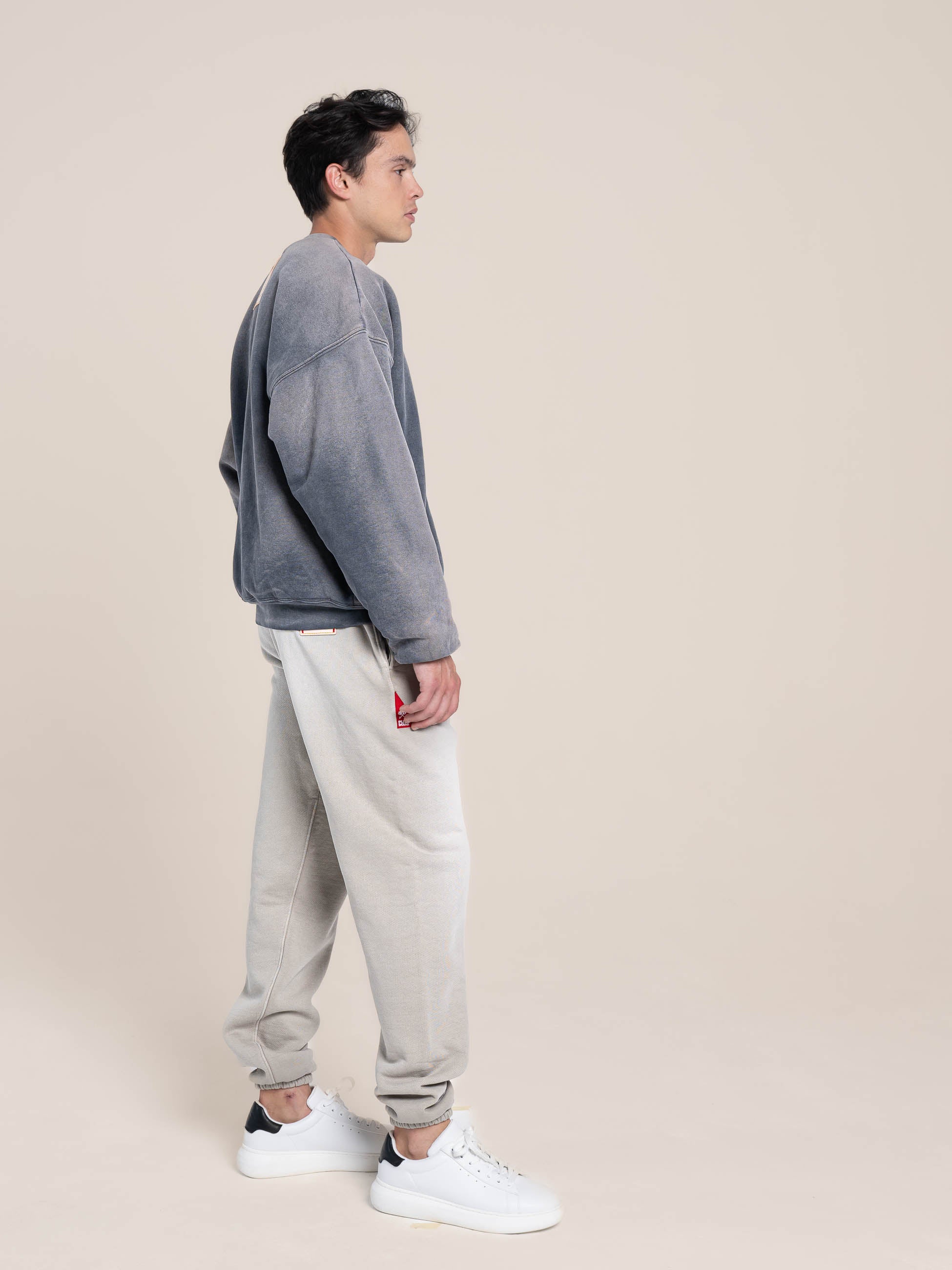 male model wears Publik Brand Double Layered Sweatshirt Crewneck Anchor Gray Heavyweight Fleece, all made in USA , side view