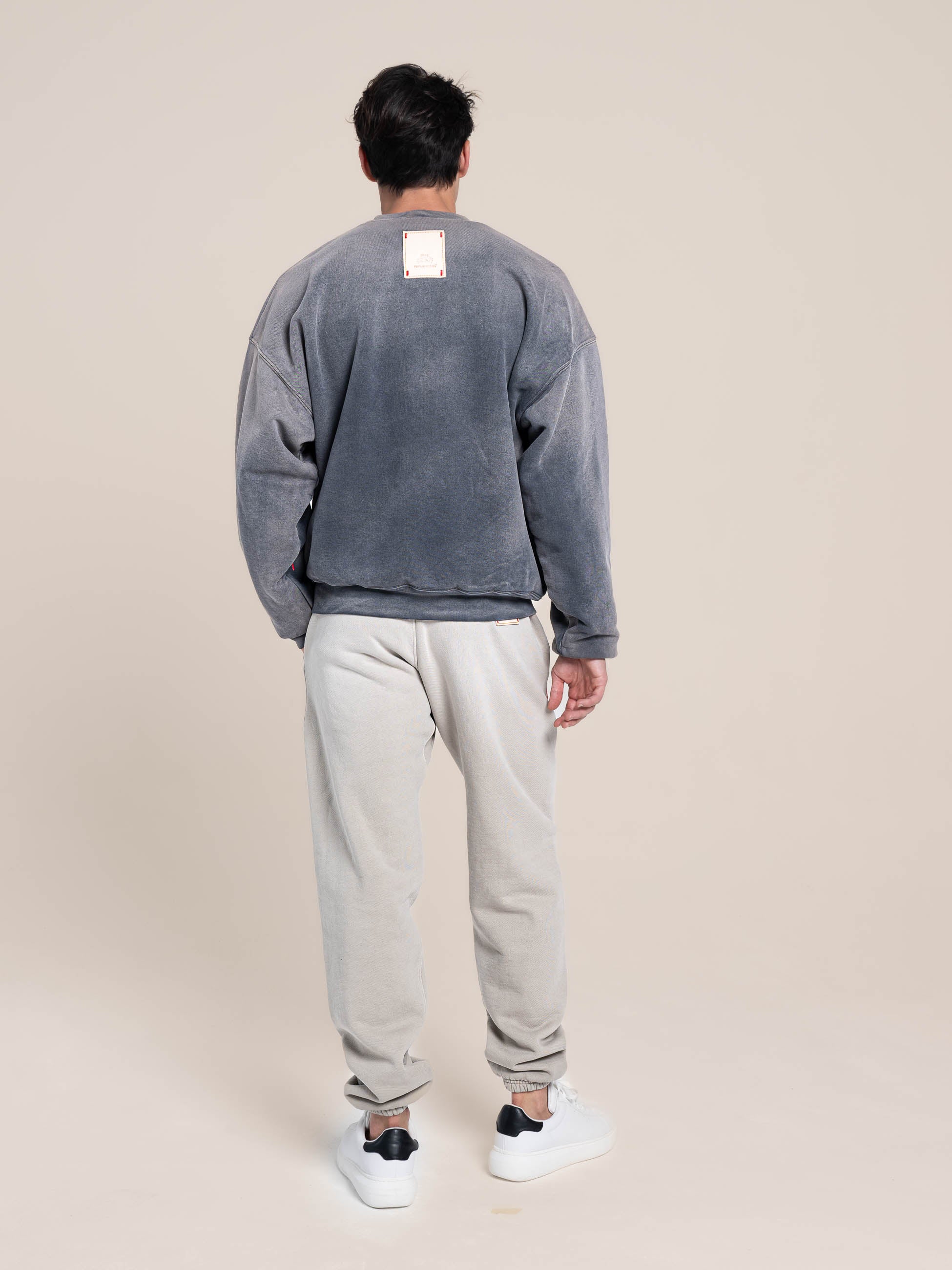 male model wears Publik Brand Double Layered Sweatshirt Crewneck Anchor Gray Heavyweight Fleece, all made in USA, back side view