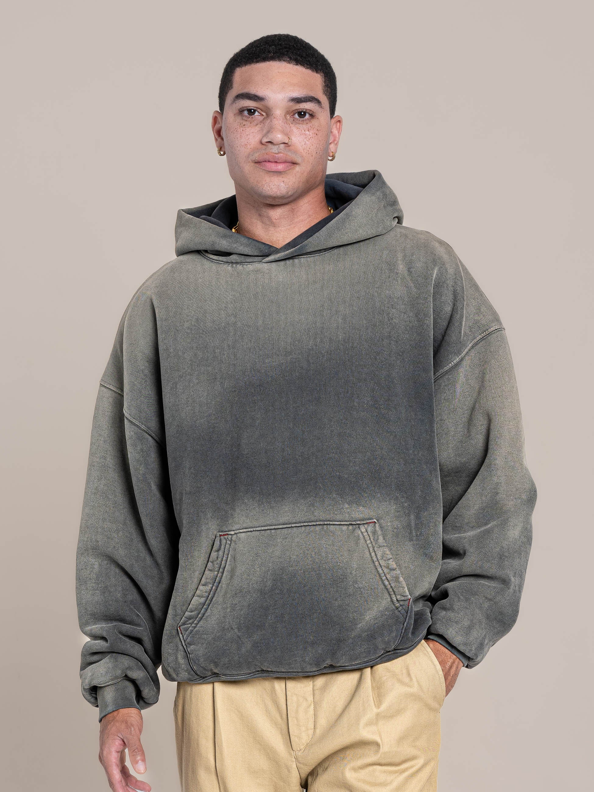 Male Model wears a Medium Size  of Publik Brand Double Layered Fleece Grey Hoodie Luxury Made in USA