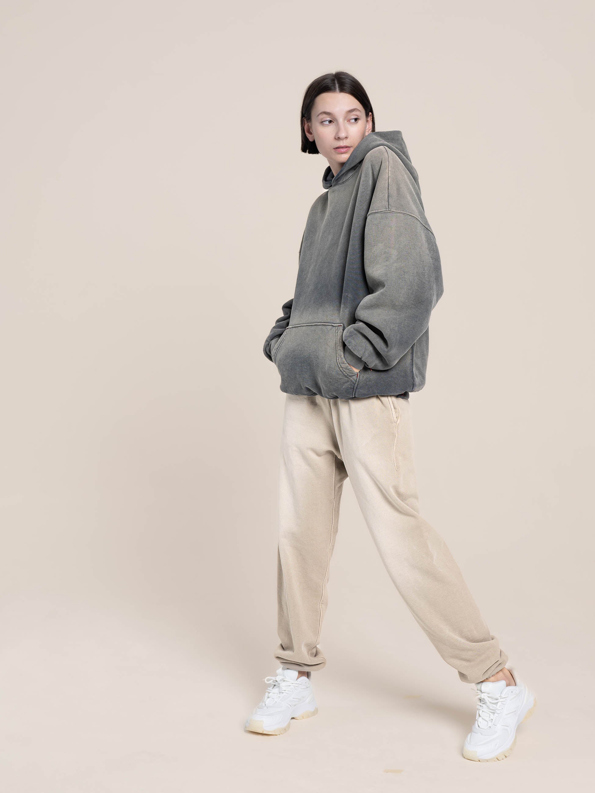 Female Model wears a Publik Brand Fleece Grey Hoodie with  Fleece  Old Wood Sweatpants Luxury Made in USA