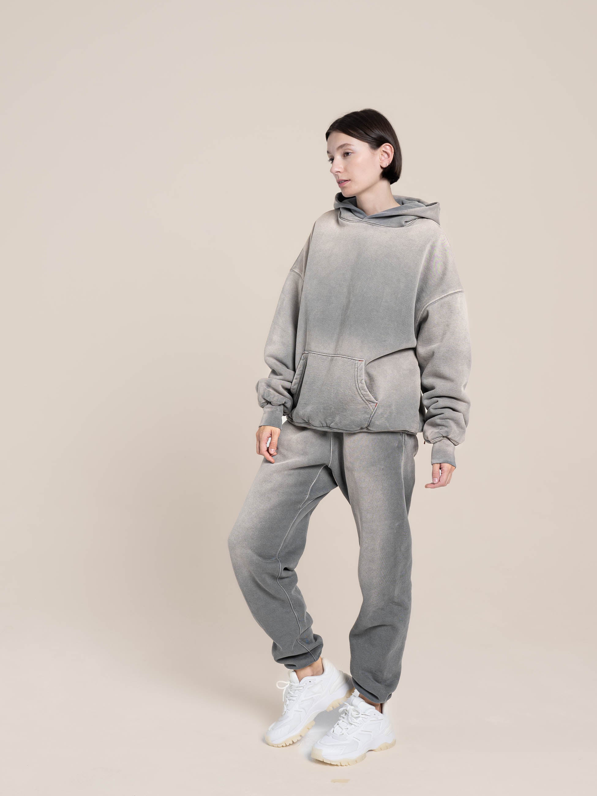 Female model wears Publik Brand Double Layered  Fleece Ash Blue Hoodie and Relaxed Fleece Ash Blue Sweatpants