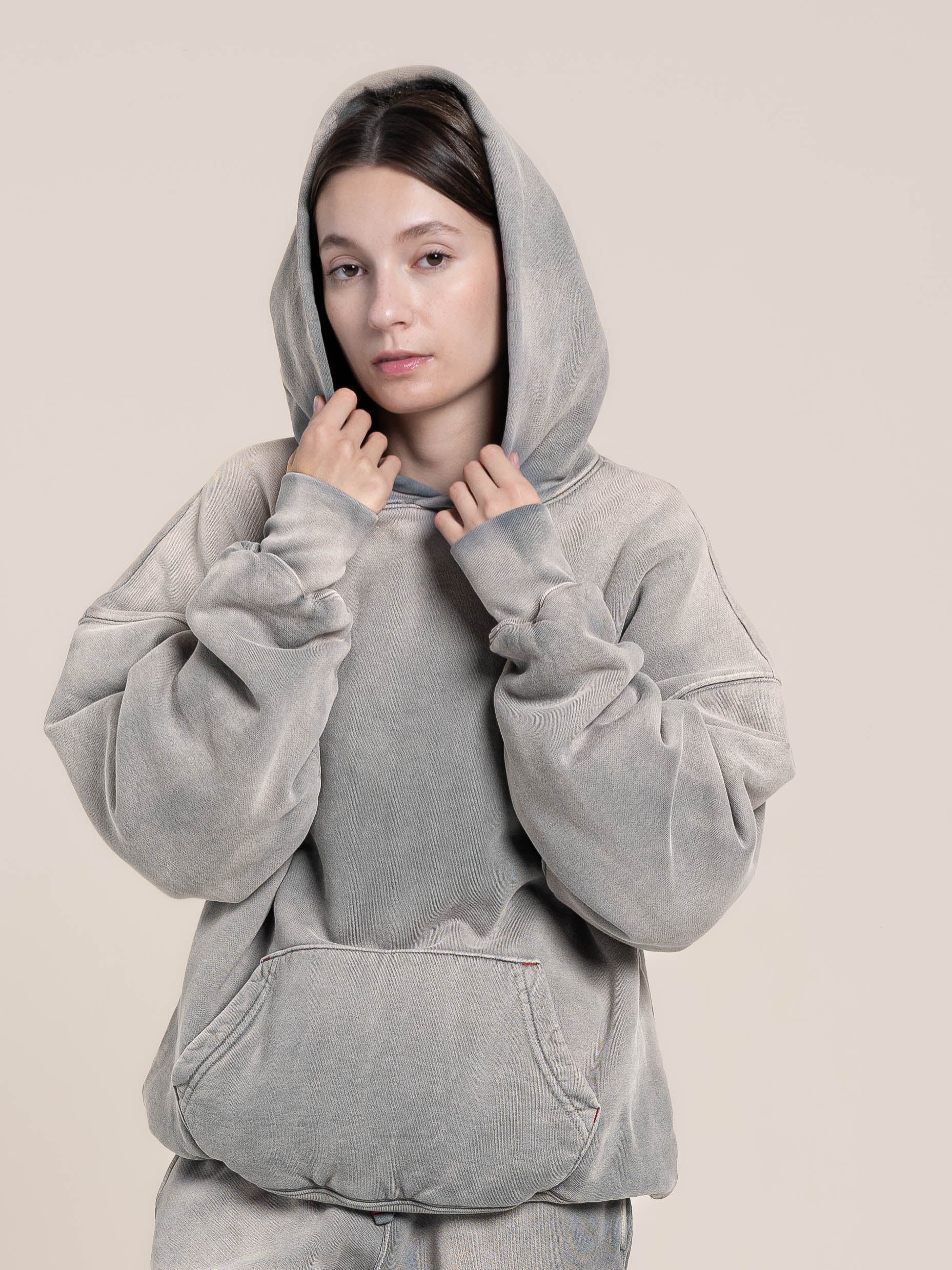 Female model wears Publik Brand Double Layered Fleece Ash Blue Hoodie