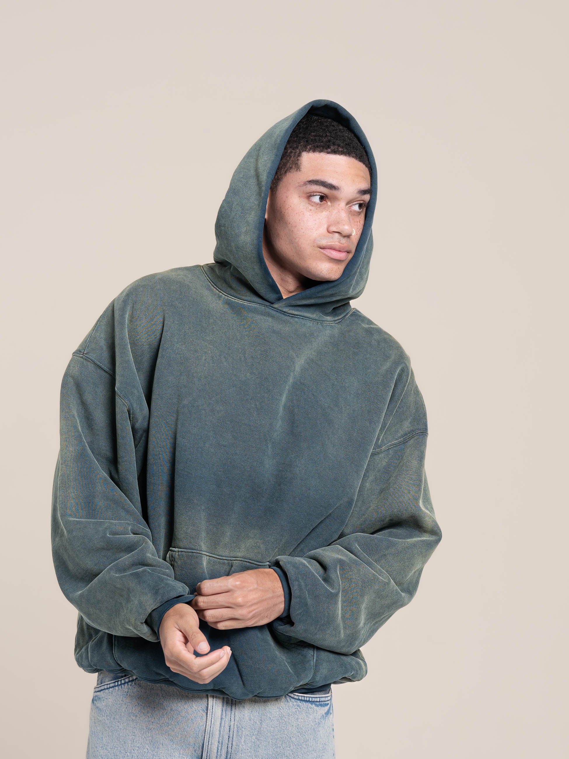 male model wears Publik Brand Double Layered Fleece Indigo Hoodie
