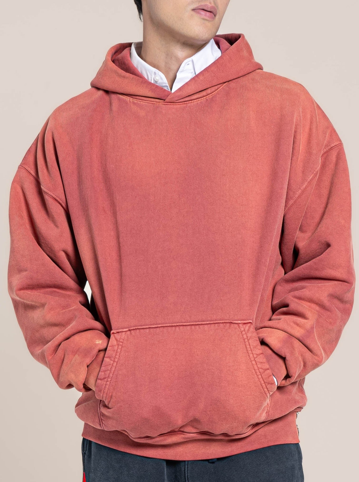 male model wears Publik Brand Double Layered Hoodie Tea Rose Red Heavyweight Fleece, all made in USA