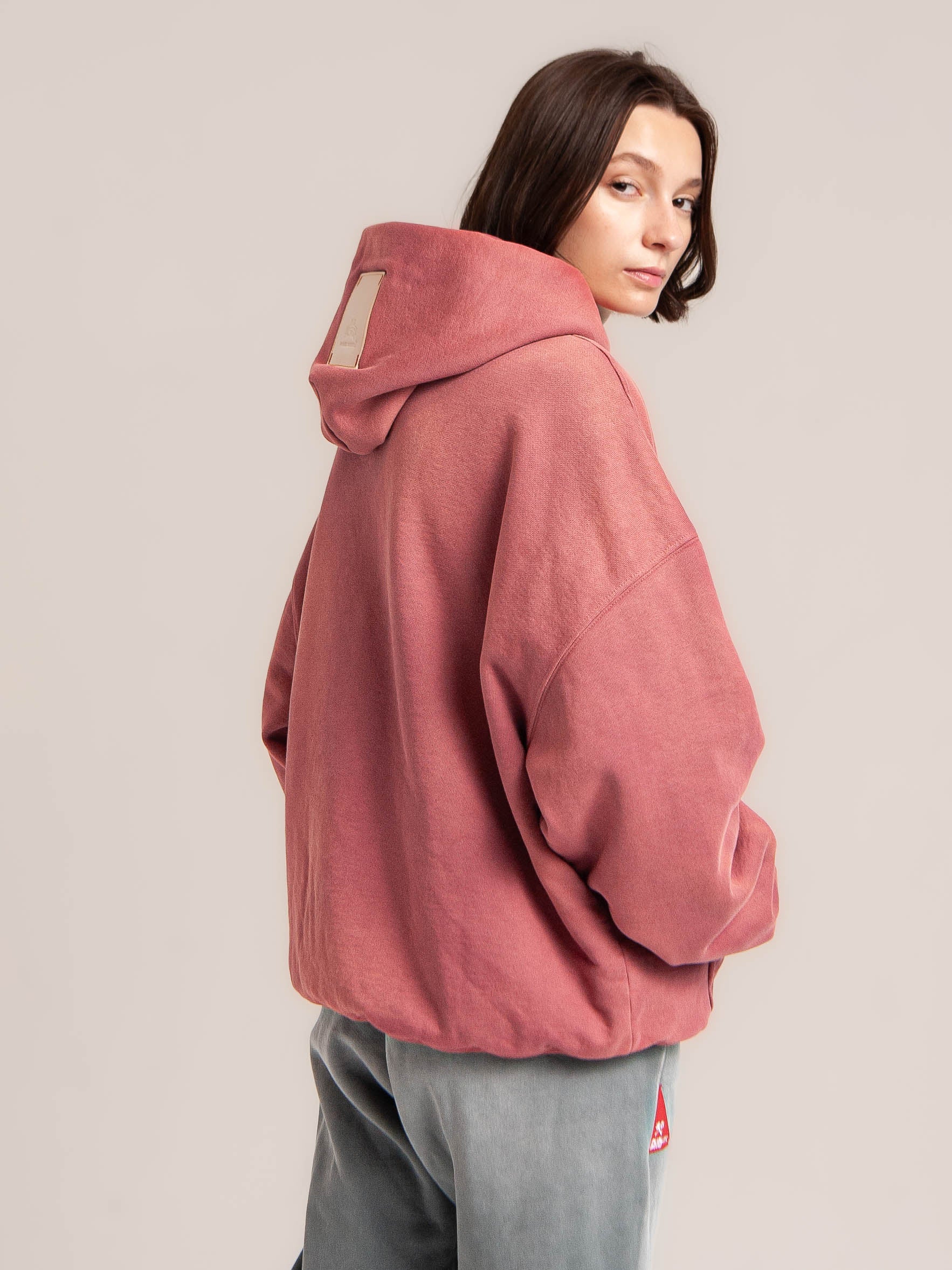 female model wears Publik Brand Double Layered Hoodie Tea Rose Red Heavyweight Fleece, all made in USA and turn around