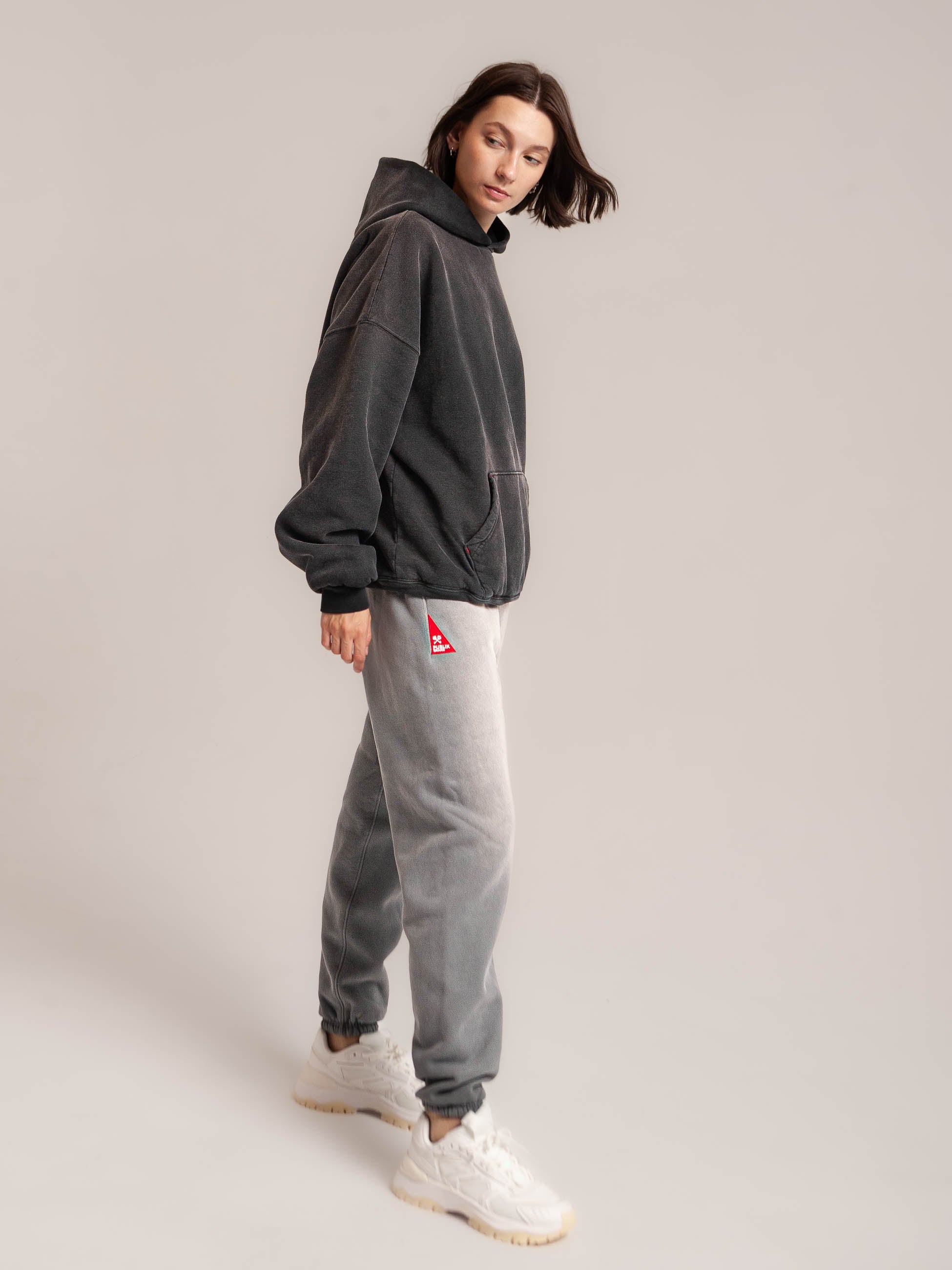 Female Model with Publik Brand  Double Layered Black Hoodie and  Ash Blue Sweatpants Double Layered Fleece Black Hoodie Flat Luxury Made in USA