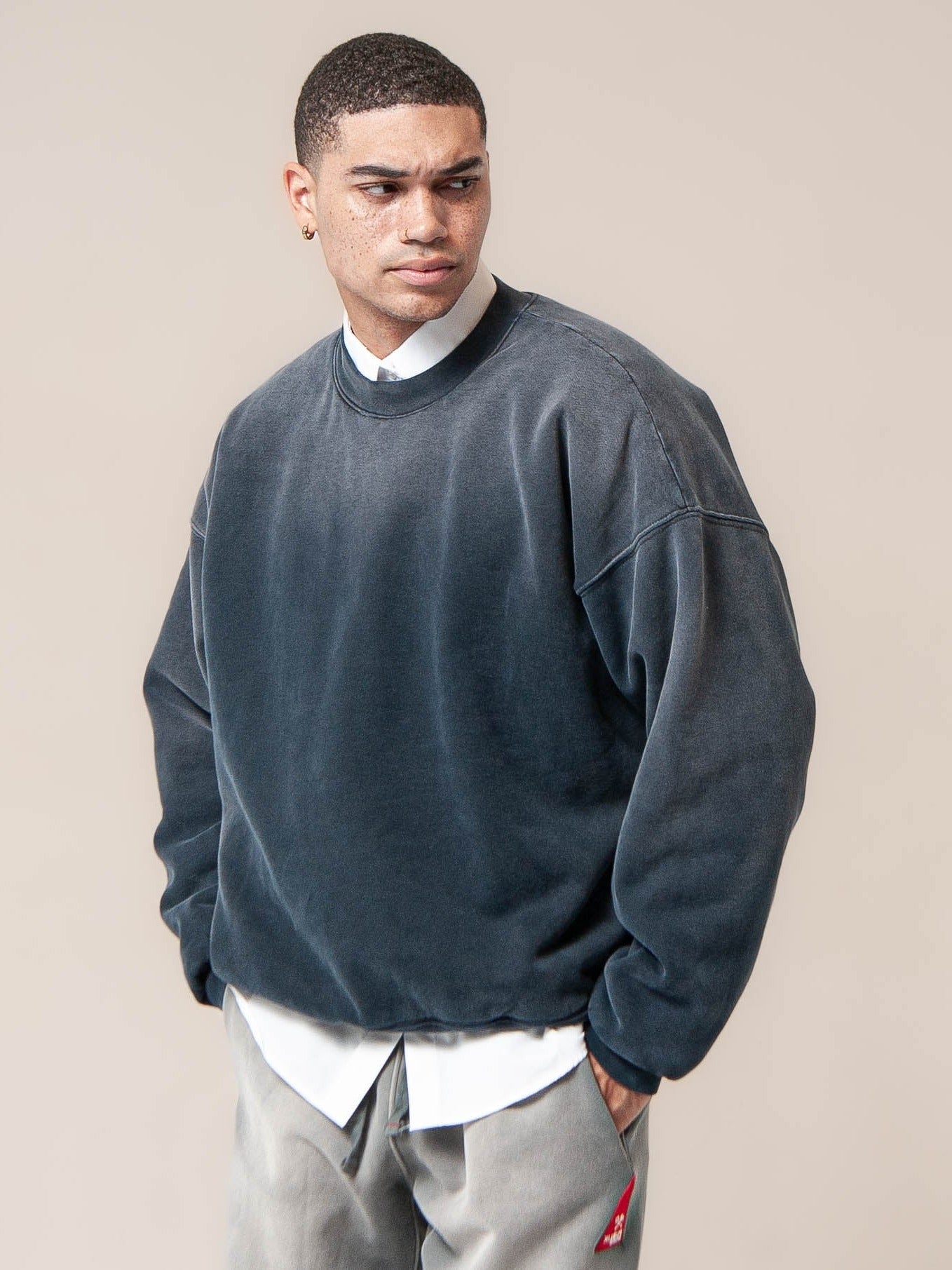male model wears Publik Brand Double Layered Sweatshirt Crewneck College Navy Heavyweight Fleece, all made in USA