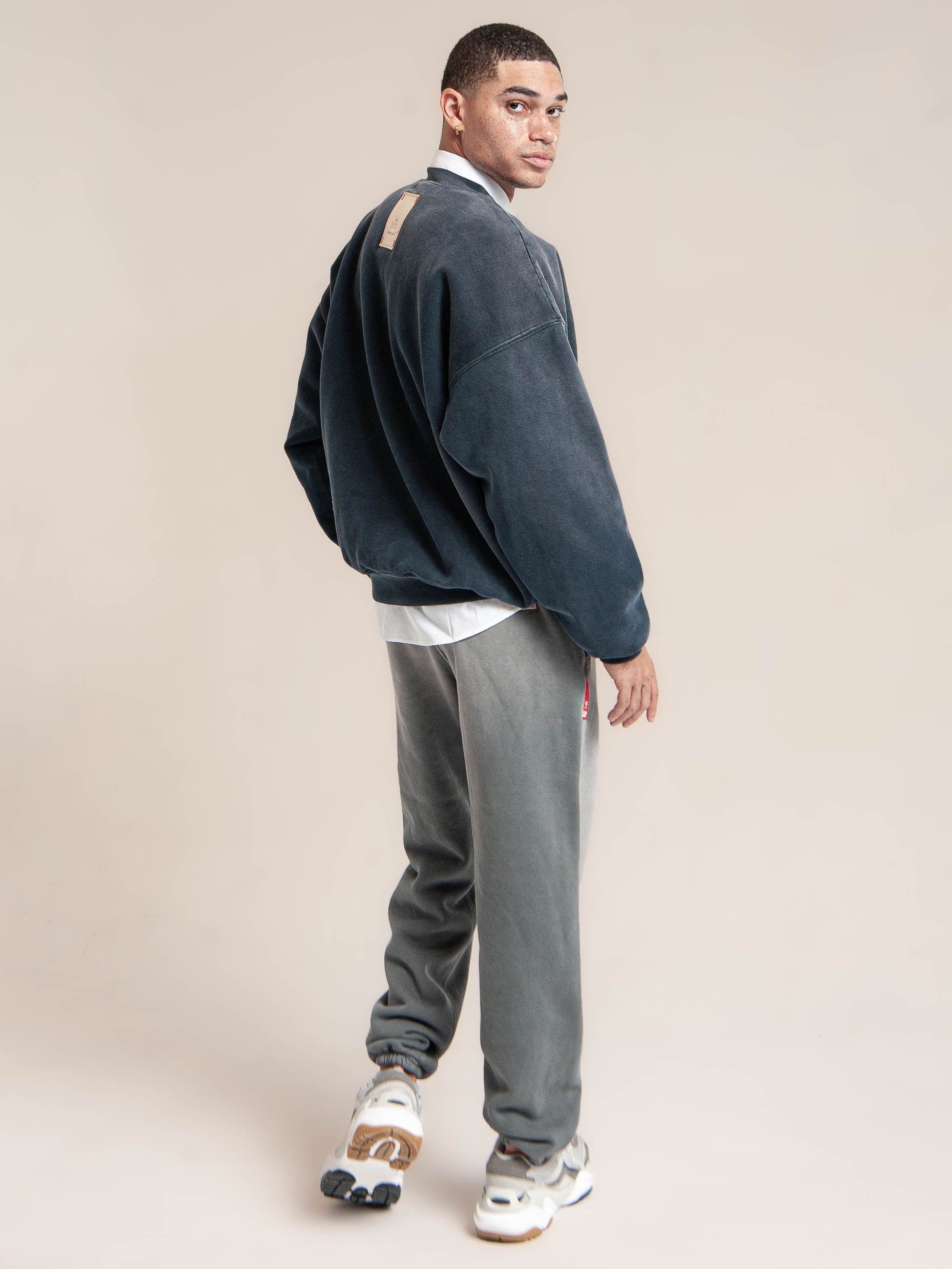 male model wears Publik Brand Double Layered Sweatshirt Crewneck College Navy Heavyweight Fleece, all made in USA, turn around back side view