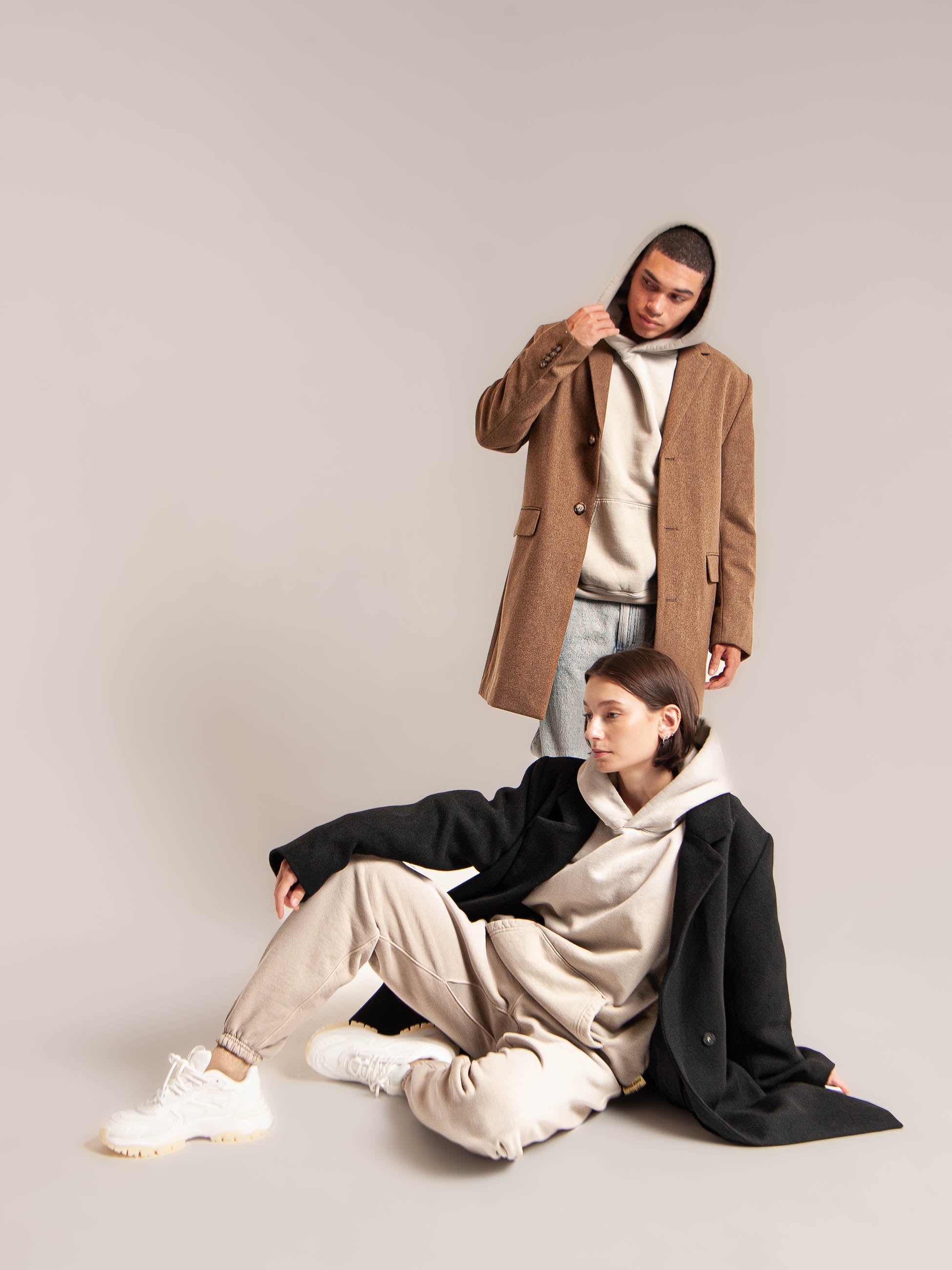 male and female model wear Publik Brand Single Layered Hoodie Old Wood Heavyweight Fleece with coats, all made in USA