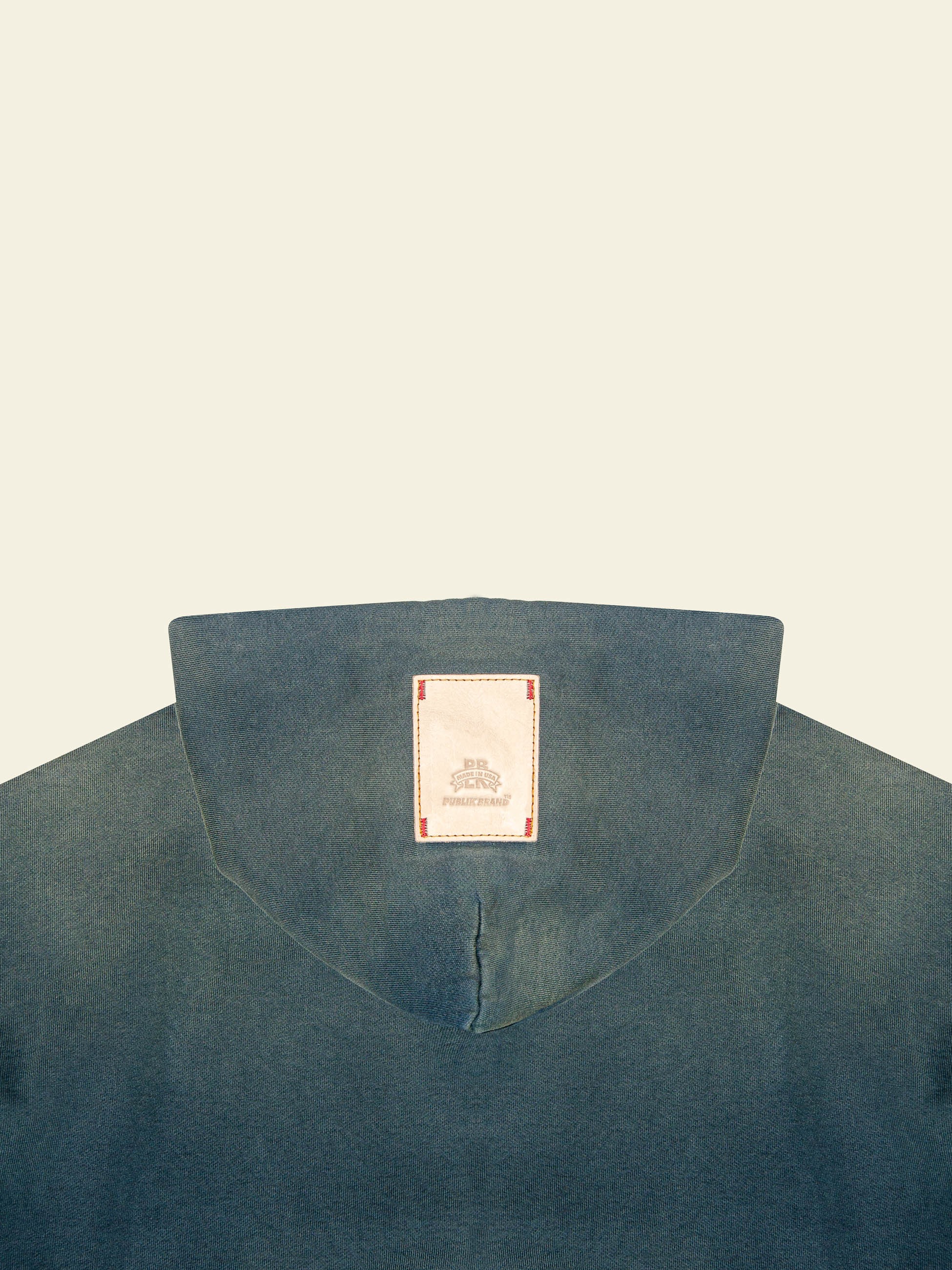 brand logo leather patch detail at the double layered indigo hood