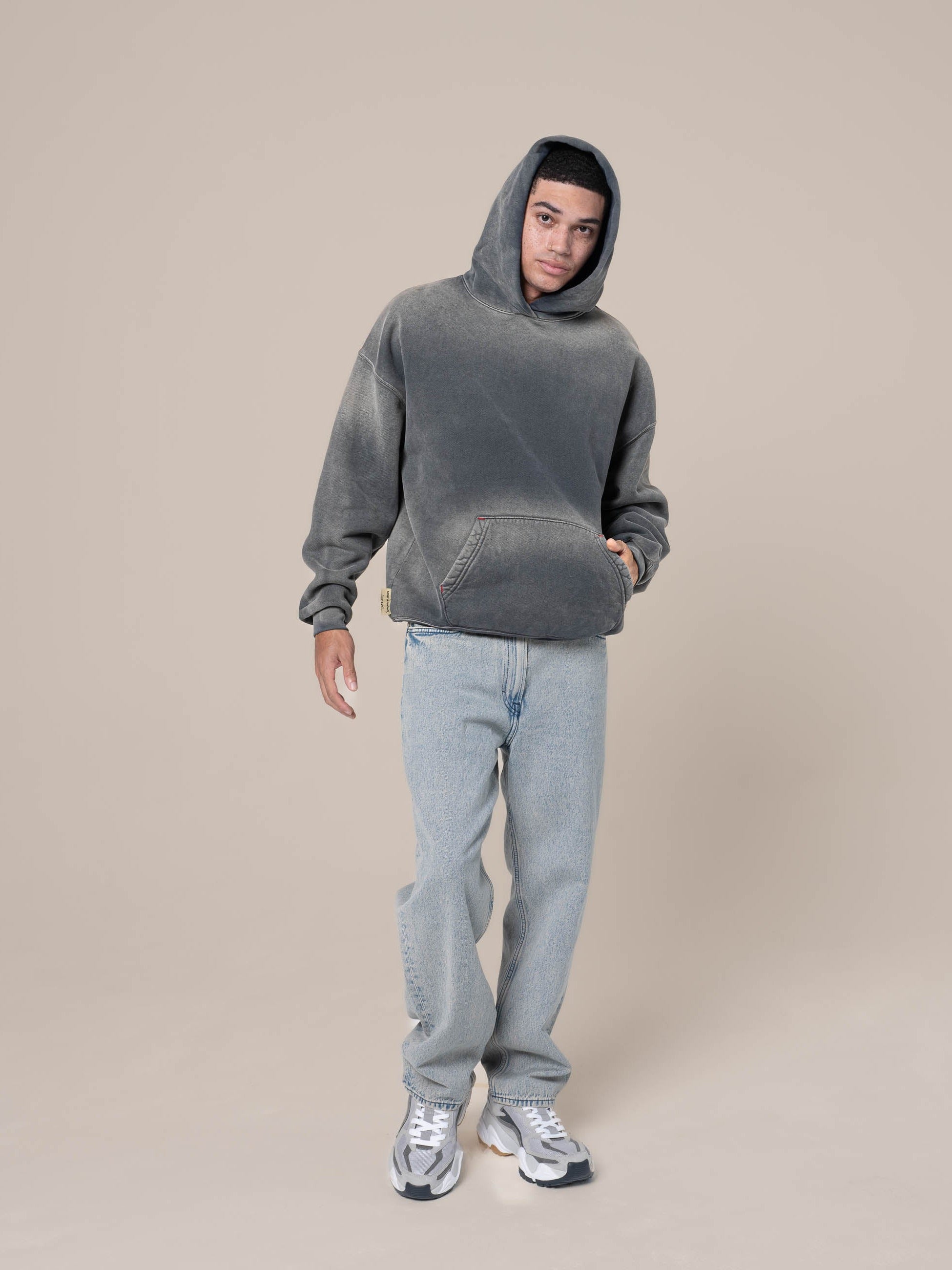 Male Model wears Publik Brand Single Layered Hoodie Anchor Gray Heavyweight Fleece, all made in USA