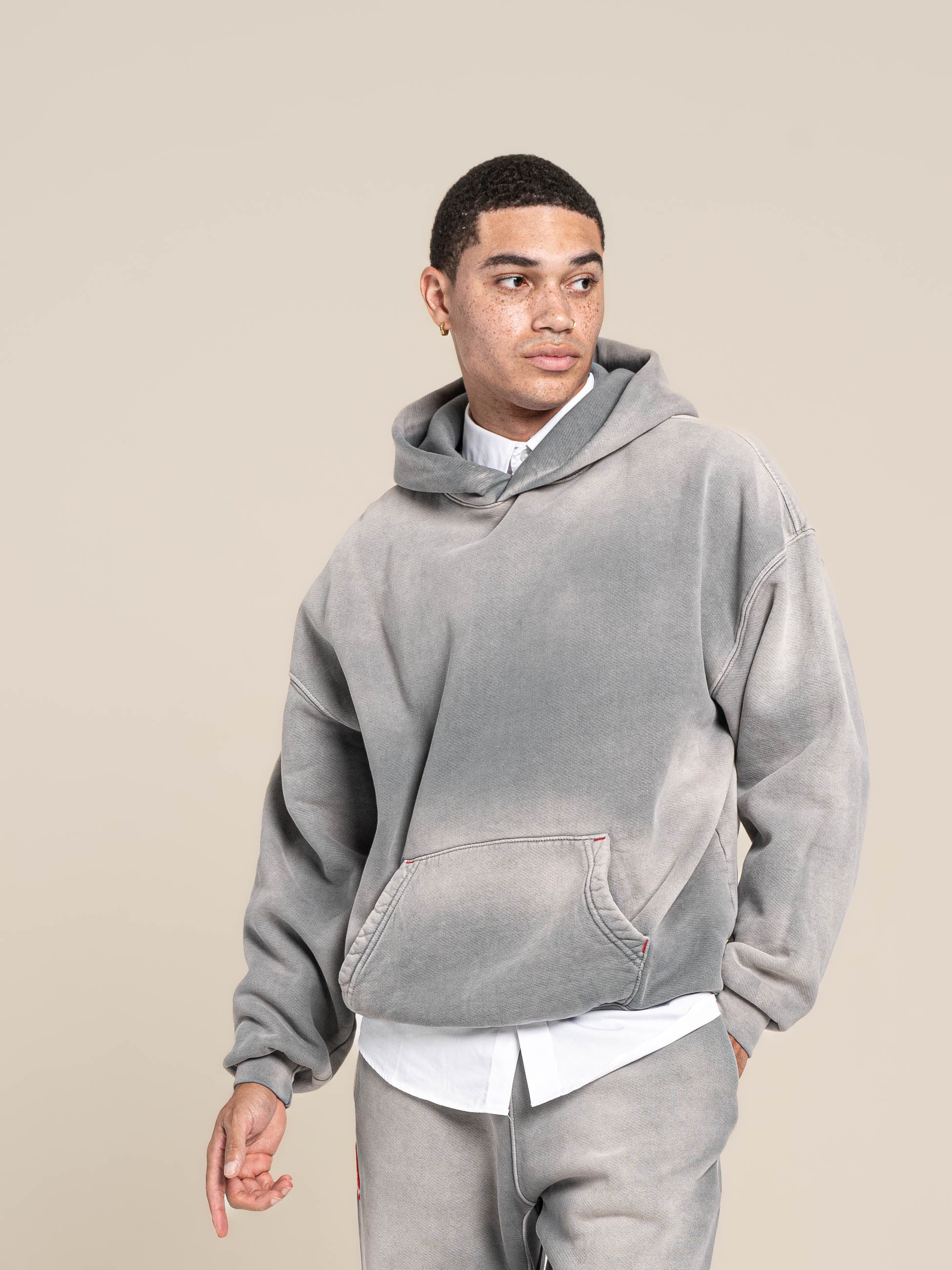 Male Model wears Publik Brand Single Layered Hoodie Ash Gray Heavyweight Fleece, all made in USA