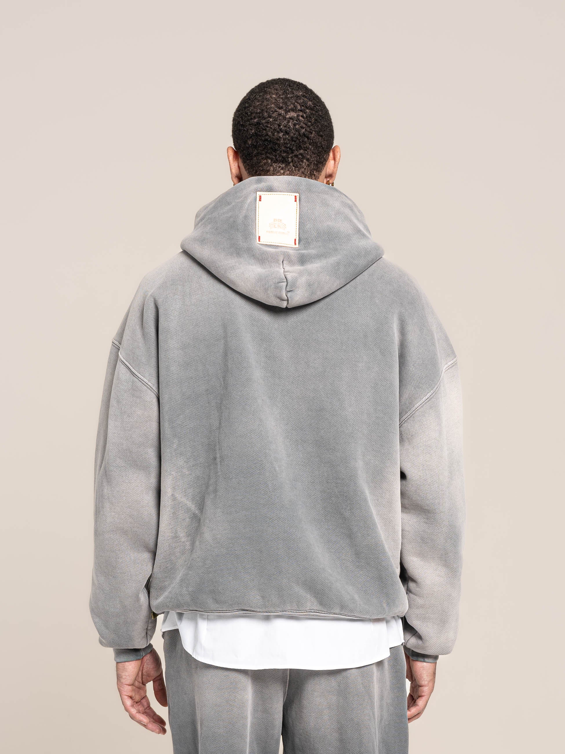 male model wears Publik Brand Single Layered Hoodie Ash Gray Heavyweight Fleece, all made in USA