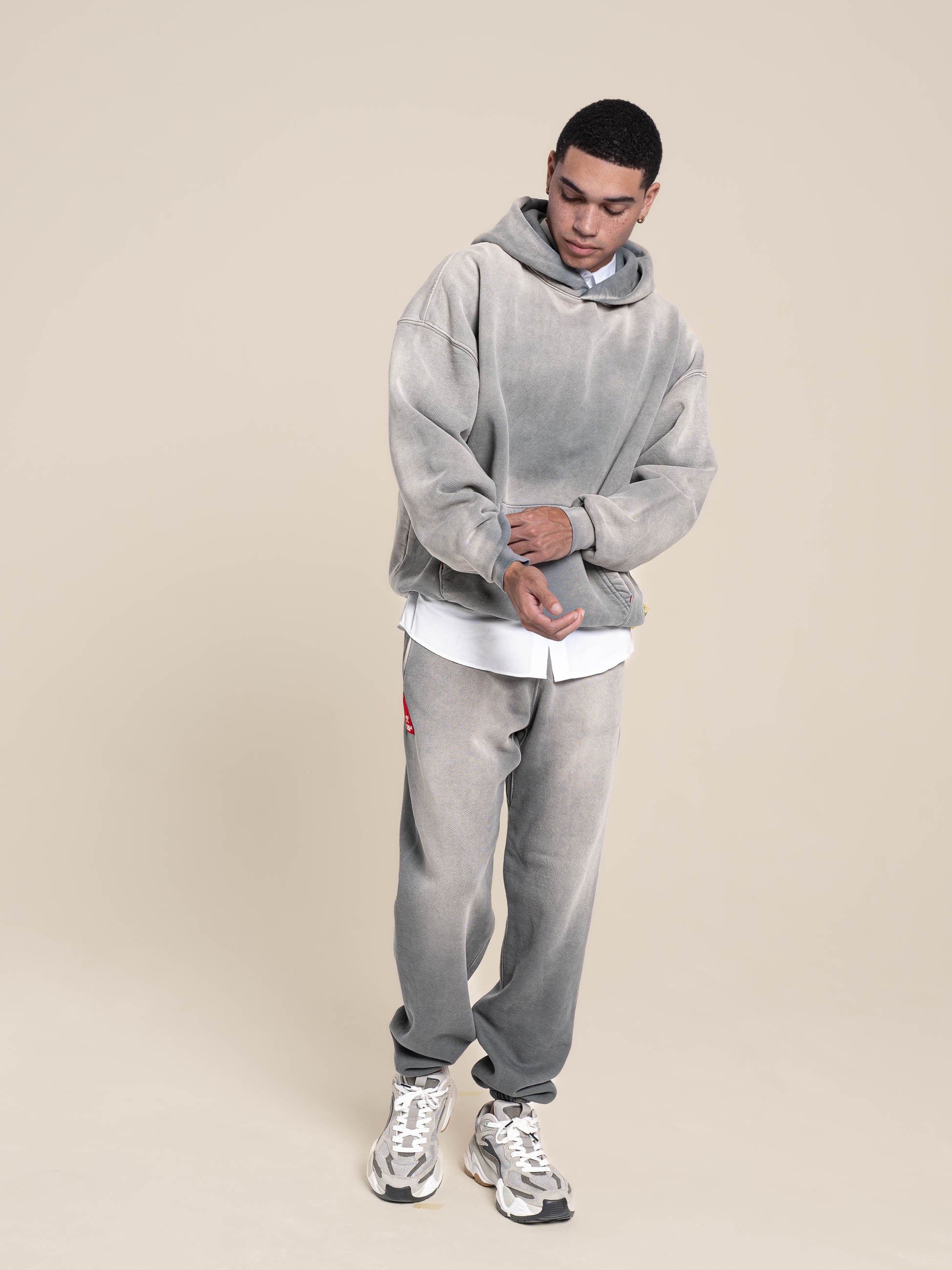 male model wears Publik Brand Single Layered Hoodie Ash Gray Heavyweight Fleece, all made in USA