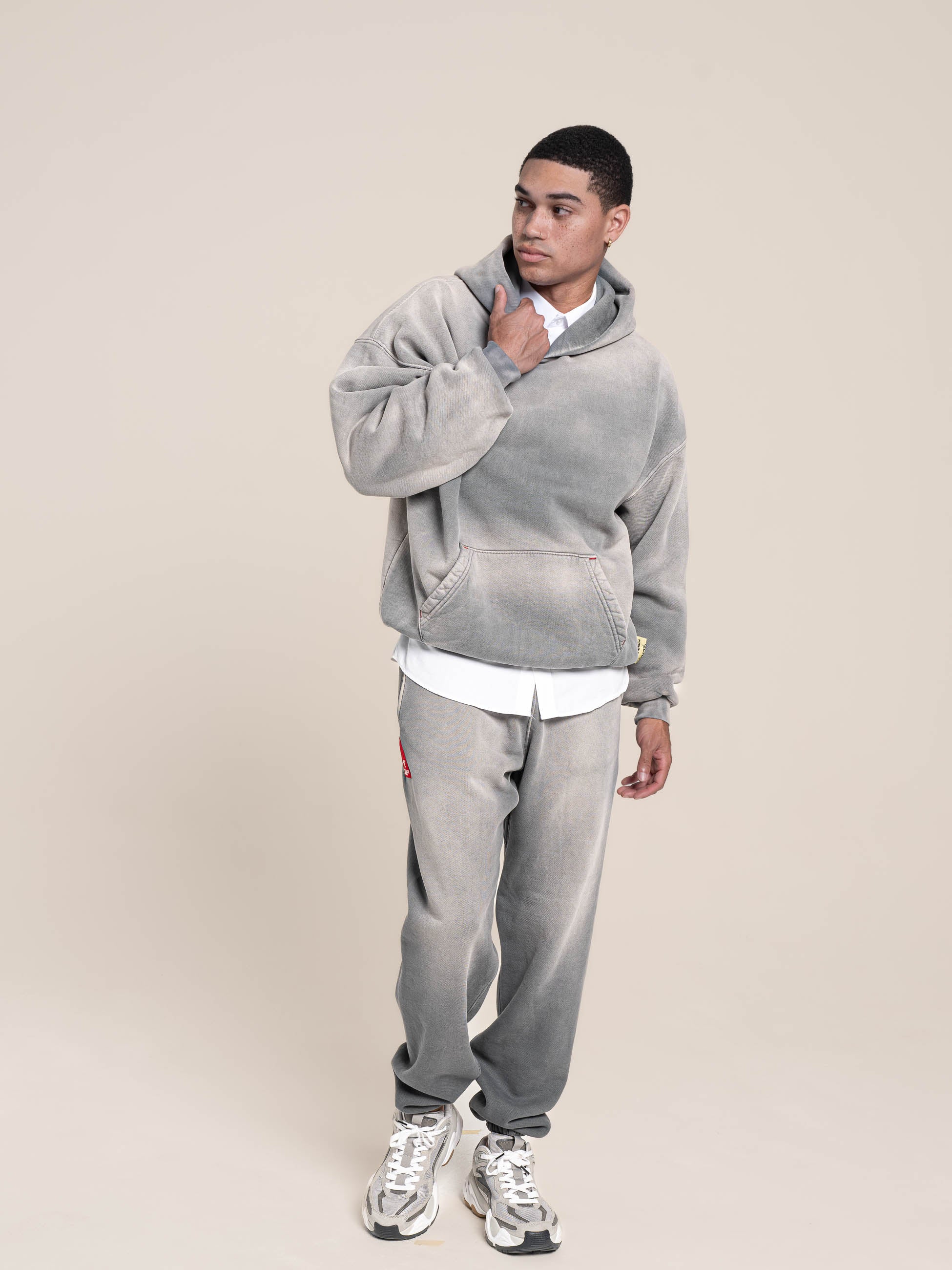 male model wears Publik Brand Single Layered Hoodie Ash Gray Heavyweight Fleece, all made in USA