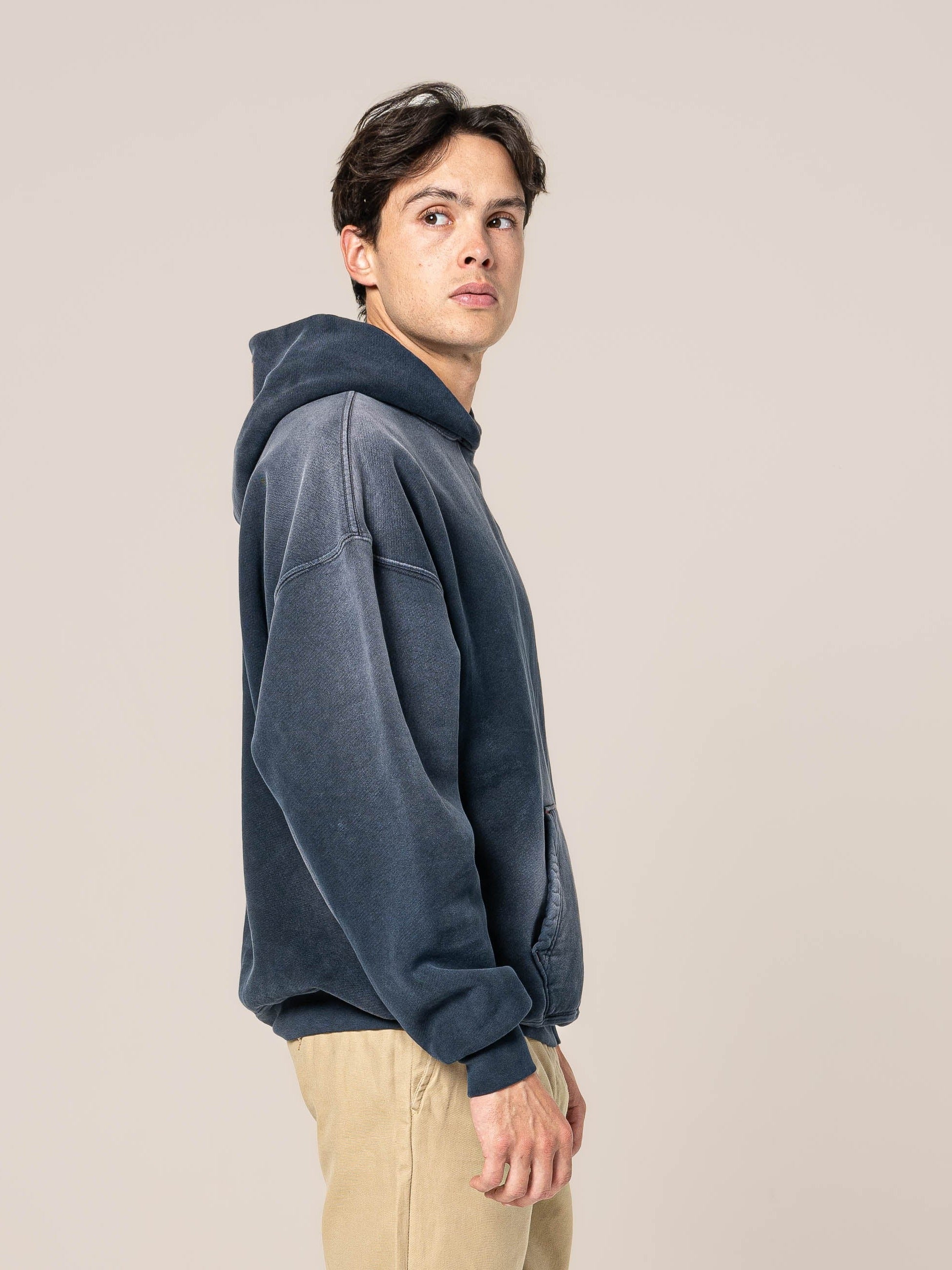 Male Model wears Publik Brand Single Layered Hoodie College Navy Heavyweight Fleece, all made in USA