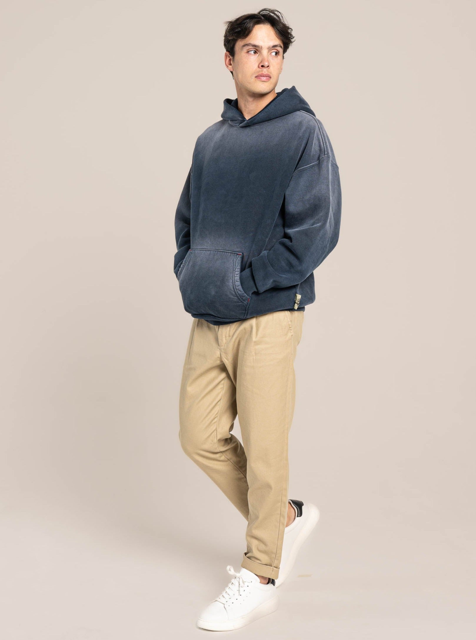 male model wears Publik Brand Single Layered Hoodie College Navy Heavyweight Fleece, all made in USA