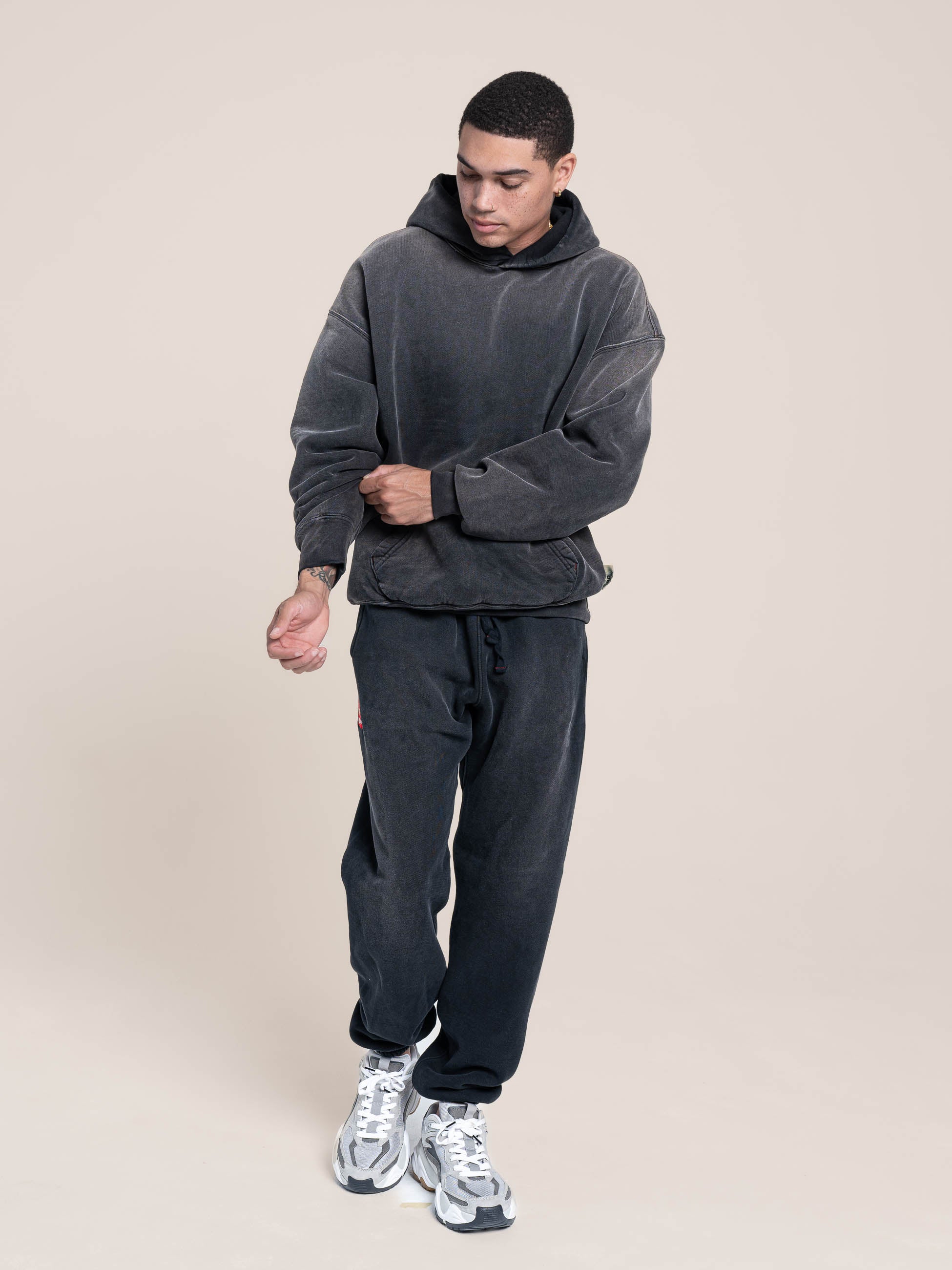 male model wears Publik Brand Single Layered Hoodie Yacht Club Black Heavyweight Fleece, all made in USA